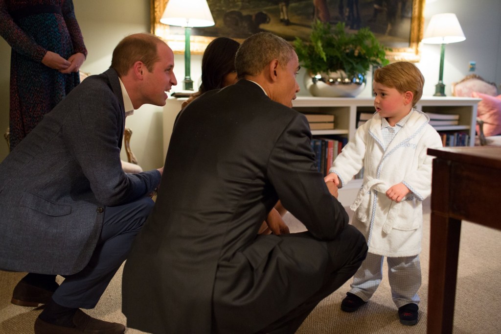 Barack Obama, Michelle Obama crouch in front of Prince George at Kensington Palace